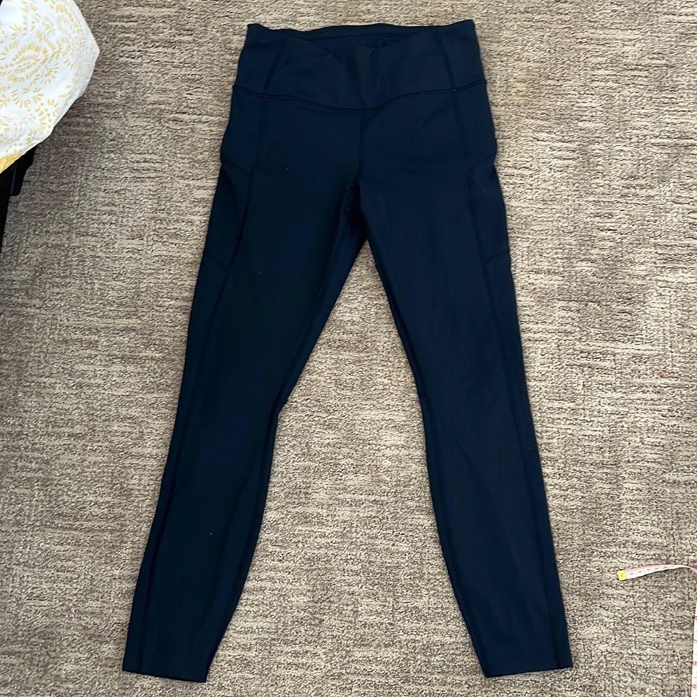 Athleta navy small laser cut zipper pocket leggings 25”